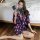 A woman poses with a fan, wearing a sheer chiffon kimono robe adorned with pink lips patterns. the design features floral acc...