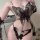 Sheer black butterfly lace bodysuit with pearl straps and matching tie-strap thong for a sensual, elegant look.