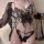 Sheer black butterfly lace bodysuit with pearl details, featuring a sensual see-through top and tie-strap thong ensemble.