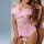 Woman wearing pink lace backless shapewear bodysuit with sheer romantic lingerie design, featuring ruffles and floral details...