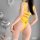 A woman models a yellow bikini-style lingerie set with an open-crotch design, featuring playful orange accents. the bodysuit ...