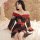 A woman wearing a pinxian sexy off-shoulder kimono sheer open cardigan set, featuring floral patterns and red accents, sits e...
