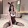 Woman in plus size bunny costume bodysuit, sexy tight-fitting role play outfit with ears and lace stockings on bed.