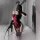 Woman in red and black lace bunny costume with open crotch, thigh highs, gloves, ears, and whip for role play.
