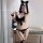 Sexy maid outfit featuring a black bow, cat ears, and garter belt design, perfect for plus-size women seeking an elegant yet ...