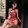 A woman wears a red sheer cloud brocade nightgown with butterfly knots, featuring a halter neck design and lace details.
