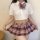 A stylish white crop top with a plaid bow tie paired with a flirty plaid skirt, perfect for schoolgirl fashion or cute bedroo...