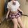 A stylish schoolgirl outfit featuring a white blouse with a bow tie and a plaid skirt, perfect for curvy women seeking a cute...