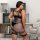 Woman modeling a plus size lace sexy bodysuit with sheer mesh and cut-out details, featuring black lingerie design.