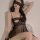 Woman wearing black lace sleepwear set with sheer mesh and push-up effect, featuring a no-remove design for plus size.