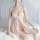 Woman wearing pink lace sleep dress with adjustable straps, sheer mermaid style satin nightgown for plus size women.