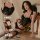Curvy woman modeling black lace teddy set with sheer mesh, underwire push-up bra and thigh-high stockings.
