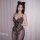 Woman modeling plus size leopard print lingerie bodysuit with lace trim and snap crotch, featuring sheer panels and cat ears ...
