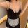 Seductive maid costume outfit featuring a black bralette with lace trim and a white apron, perfect for plus-size women seekin...