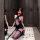 Model wearing plus size pure temptation lingerie set with lace, pencil skirt, and fishnet stockings.
