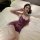 Woman wearing plus size purple lace lingerie sleep dress, sheer sexy sleepwear for women, small bust friendly bedroom set.