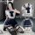 A woman poses wearing a sailor uniform set, featuring a white crop top with navy blue accents, a pleated skirt, and thigh-hig...