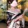 A woman wears a plus-size seductive geisha kimono-inspired erotic costume, featuring a low-neck design with floral patterns a...
