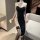 Black high-slit lace bodysuit with nun-inspired collar, sheer stockings, and garter. seductive plus-size lingerie set for wom...