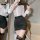 Woman wearing plus size seductive office outfit with white blouse and black skirt, styled like a secretary or airline hostess...