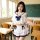 A woman models a plus-size sailor-style lingerie set, featuring a white crop top with ruffles and a navy bow, paired with a m...
