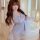 Woman wearing plus size sensual lace sleepwear set with sheer mesh cami and slip dress in soft lavender.