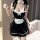 Woman wearing black and white maid costume lingerie with apron, ruffles, and bow details for role play or sleepwear.
