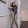 Sexy bondage bodysuit with intricate web design, black leather material, perfect for seductive allure and erotic expression.