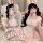 Model wearing pink plus size sexy lace bunny girl costume set with sheer mesh, ruffled trim & ears for cosplay maid look.