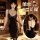 Sexy black lace cami dress with deep v neckline and thigh-high stockings, perfect for evening wear or sleepwear.