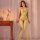 Woman modeling neon green lace-up fishnet bodysuit with tear-away crotch, sheer mesh lingerie in bedroom setting.