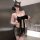 Woman wearing black sheer mesh sleep dress with lace details and bow, featuring an open-crotch design for role play.