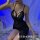 Woman wearing black lace sleepwear with high slit, sheer mesh design, and provocative uniform style for plus size.