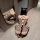 Woman wearing plus size leopard print lingerie set with cat ears, kneeling in front of mirror.