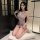 A woman poses elegantly in a plus-size sexy lingerie set featuring a deep v-neck lace sheer temptation nightdress with a tigh...