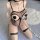 Woman wearing plus size leopard print lingerie set with fishnet stockings and choker, featuring a one-piece seductive sleepwe...