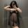 Curvy woman in sheer black lace lingerie set, posing seductively with phone mirror selfie. midnight passion nightwear for plu...