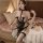 Woman modeling plus size sexy lingerie set with sheer transparent fabric and bdsm-inspired straps.