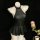 Black leather-look pleated mini skirt and halter top lingerie set on mannequin. busty oi uniform style outfit for confident w...