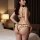 Woman wearing plus size sexy lingerie sleepwear set with removable cup bra and thong in bedroom setting.