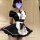 A woman models a black and white maid costume set, featuring a ruffled apron and puffed sleeves, perfect for a cute and allur...