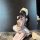 A person wearing a plus-size maid costume, featuring a flirty chef outfit with ruffled hem, sweet bunny ears, and playful acc...