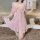 A woman poses in a sheer pink lace sleep dress with delicate ruffles and lace detailing, featuring adjustable straps and reve...