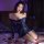 Woman wearing plus size sexy sheer one-shoulder office secretary outfit with provocative bodycon skirt set, posing on bed wit...