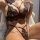 Woman modeling black prilin lace lingerie set with eyelash trim, featuring a sexy bra and panty two-piece outfit.