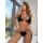 Woman wearing black pu leather lace-up cut-out bikini set, sexy two-piece lingerie with strappy design and sheer panels.