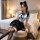 A woman poses in a stylish navy sailor collar outfit with a cute black skirt, perfect for a feminine and playful look.