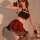 A woman poses elegantly in a red bow pleated skirt, part of the pure & alluring jk uniform set, featuring a halter top and st...