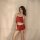 A woman poses in a red lace cami sleep set, featuring delicate lace trim and a minimalist design, perfect for comfortable nig...
