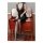 A woman sits on a wooden vanity wearing a black lace sheer cami sleep dress, paired with opaque stockings. the elegant design...